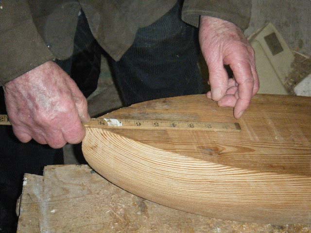 Loughie checks the measurements of one of the hulls. Photo: SR.